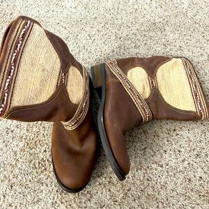 Western boots.  Brown and woven threads design.